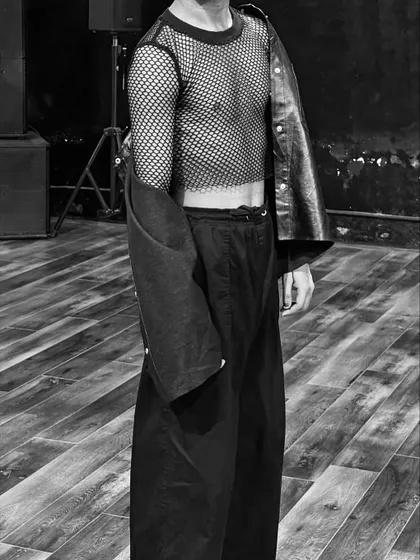 A close-up detail of the mesh and leather outfit. The textures and layers of an outfit are just as important as the overall look.
