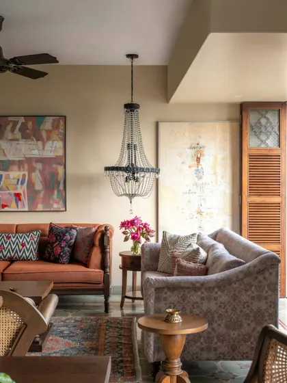 We designed this Calcutta living room to feel like a warm embrace. It’s a space layered with textures and memories, from the vintage-inspired furniture and rich upholstery to the carefully chosen art. The elegant chandelier adds a touch of old-world charm, creating a perfect setting for a family that loves to gather and share stories.