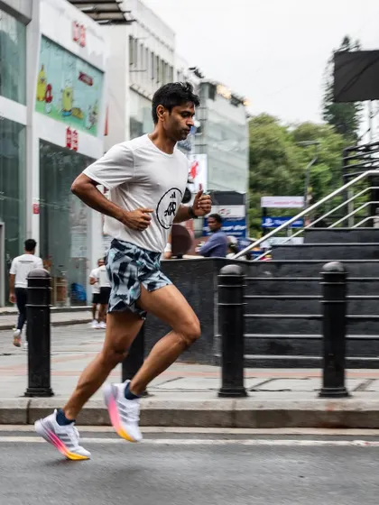 A runner in his element, striding through the city streets during one of our group runs.