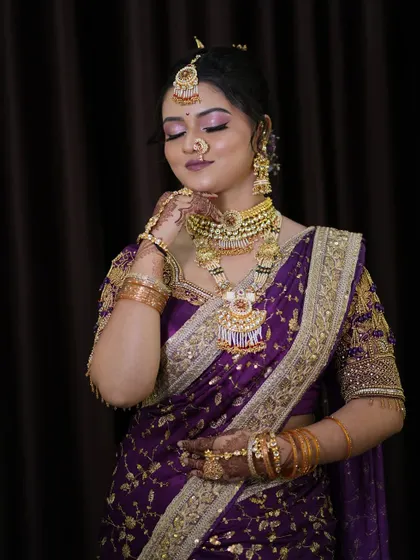 A soft, candid moment of the bride. Her makeup is flawless even up close, with a smooth base and beautifully blended eyeshadow that makes her eyes pop.