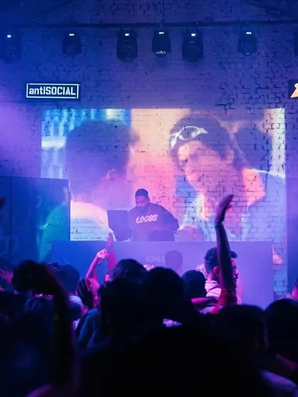 The crowd watching classic 90s Bollywood visuals on the screen behind me. Thematic events are about full immersion, including visuals.