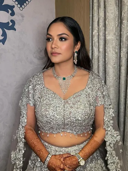 Another angle of Ishita's classic smokey glam. The blending is seamless, creating a look that is dramatic yet sophisticated for her cocktail party.