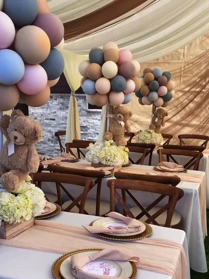 Celebrating a new arrival? We design adorable and elegant setups for baby showers and naming ceremonies, like this teddy bear-themed table with soft-hued balloons and floral arrangements.