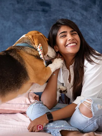 A Beagle giving his mom a sweet kiss on the cheek. These spontaneous displays of affection are what family sessions are all about.