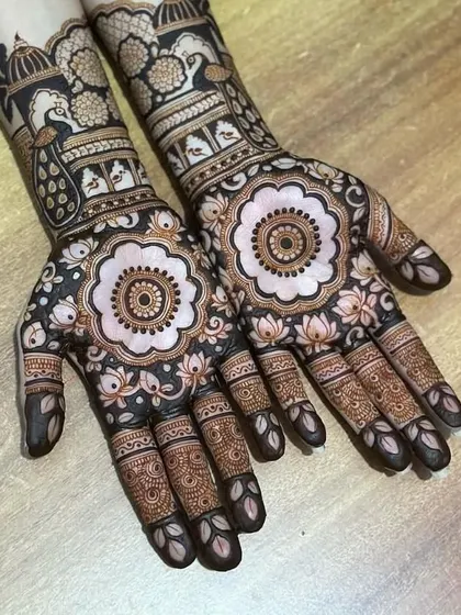 This design features large, beautiful mandala flowers on the palms, with peacock and architectural details on the arms.