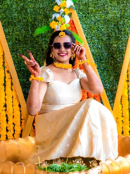 A fun and stylish bride enjoying her Haldi ceremony. I love capturing these modern, candid moments that show the bride's personality.