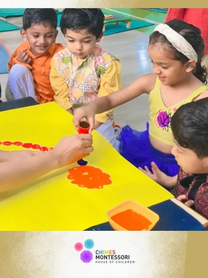 Children gather around a table for a group art project, their faces full of curiosity and excitement.