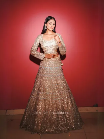 Another full-length shot of the golden lehenga, a perfect choice for a reception.