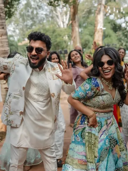 The energy of the baraat and pre-wedding festivities is infectious. We capture the couple and their friends dancing, playing games, and celebrating with pure, uninhibited joy.