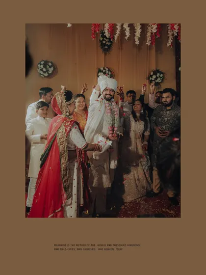 A moment of celebration after the wedding rituals, with the family cheering on the happy couple.