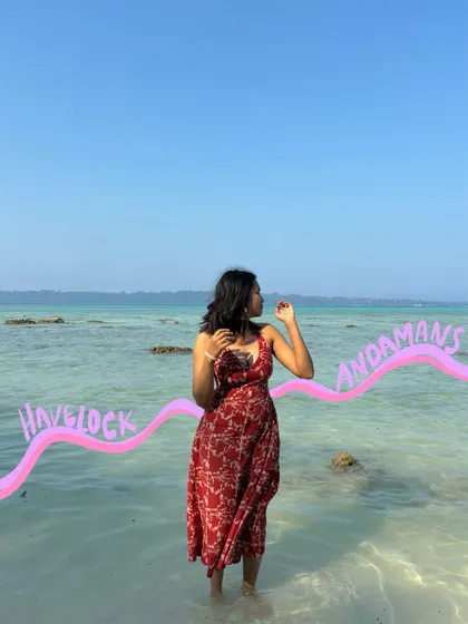 Havelock, Andamans. A wavy line of text follows the horizon, beautifully integrating the location into the photo.