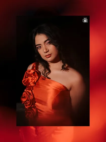 An artistic take on the red dress shoot, using a red colour overlay and creative framing. This shows how I experiment with post-production to create unique, eye-catching editorial images.