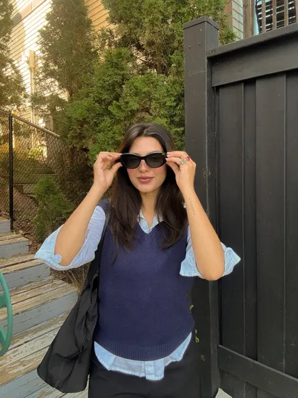 Adjusting my sunglasses, a perfect accessory for this smart-casual outfit.