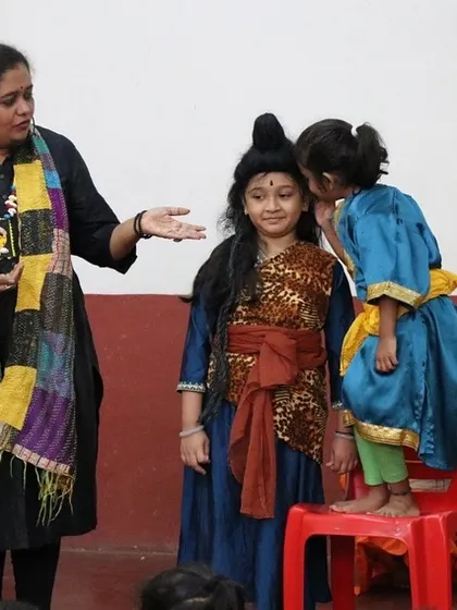 A little one whispering a secret to a character during the performance. These unscripted interactions are often the most magical.