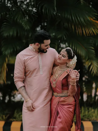 A sweet and classic portrait of the bride and groom, their smiles radiating happiness.