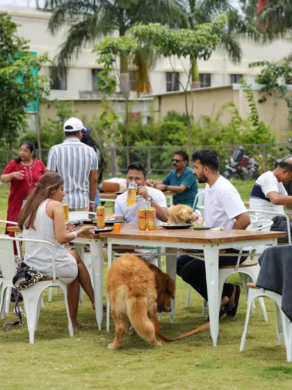 Friends enjoying a Sunday brunch with their dogs right by their side. Our outdoor seating allows your pets to be part of the dining experience.