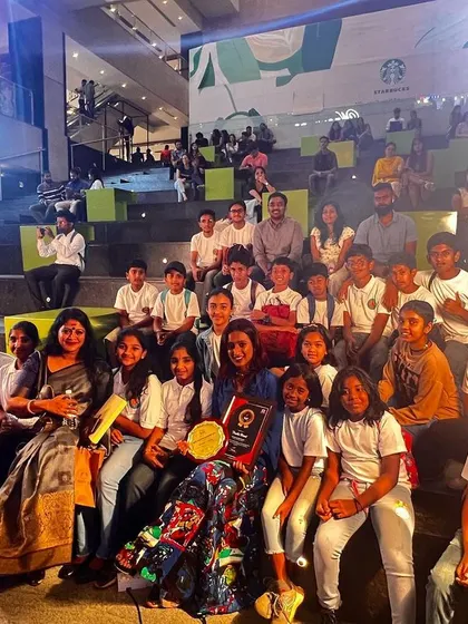 Surrounded by my students after receiving the Red Shakti Award. Their presence made the honor even more special, as they are the reason I do what I do.