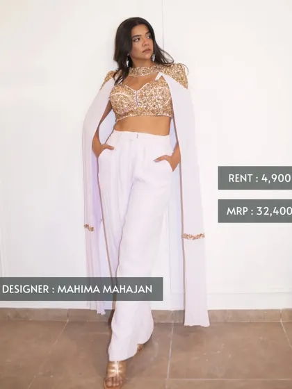 This is what smart luxury looks like. You can own this chic Mahima Mahajan cape top and pants set, originally priced at ₹32,400, for just ₹4,900. It's perfect for a modern wedding guest look.