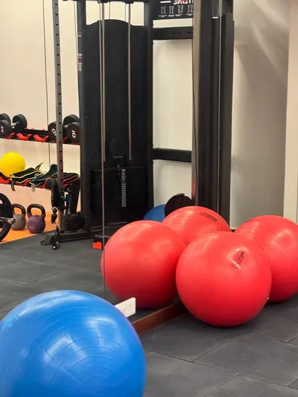 A close-up of our strength and stability equipment. We have a wide selection of stability balls, dumbbells, kettlebells, and a cable machine to provide endless variety in your training program.