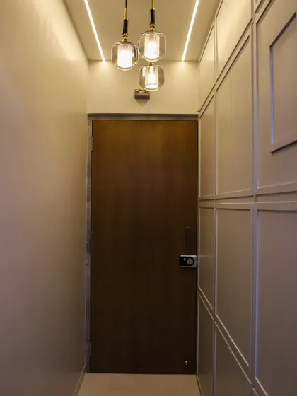 These pendant lights are used to illuminate an entryway, creating a welcoming first impression with their stylish design.