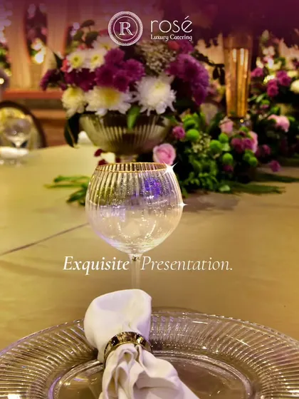 Exquisite presentation is our promise. This image captures a beautifully set table with our premium glassware and a neatly folded napkin, reflecting our attention to every detail of the dining experience.