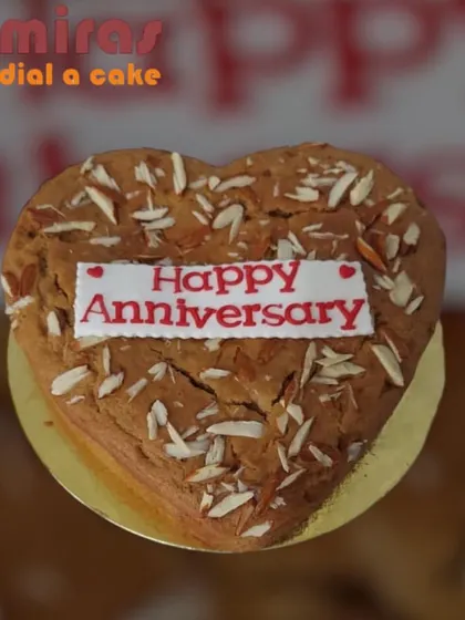 A wholesome and rustic heart-shaped wheat and almond cake. Topped with sliced almonds, this is a great option for those looking for a healthier, yet still delicious, anniversary treat.