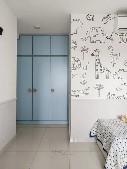 Designed for a little boy who loves blue and animals, this room features a stunning black-and-white animal wallpaper that brings his passion to life while maintaining a balanced, neutral look.