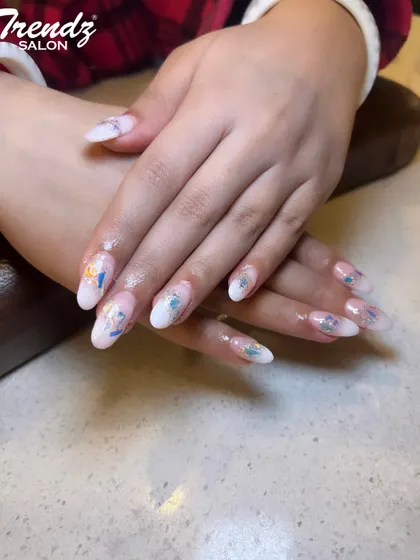 This delicate design is perfect for spring and summer. I used a milky white base on these almond extensions and applied beautiful, watercolor-style butterfly and floral decals for a soft, artistic look.