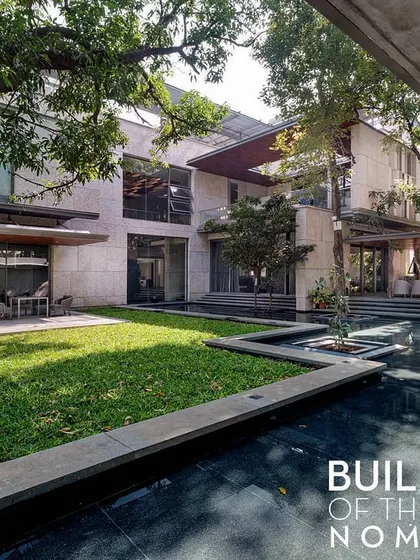 The Aqua Grid house, a nominee for ArchDaily's Building of the Year. The design is organized around a series of water courts and preserves the site's mature trees, creating a residence that is fully integrated with its natural setting.