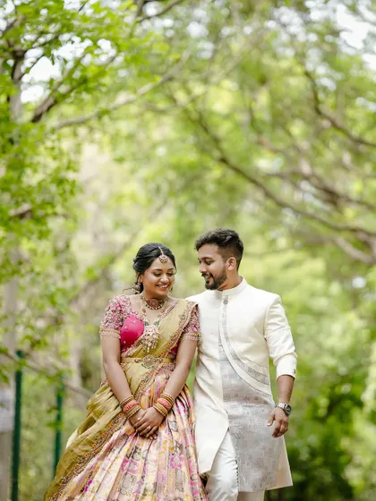 A lovely photo of the couple, her traditional jewellery perfectly complementing their coordinated outfits.