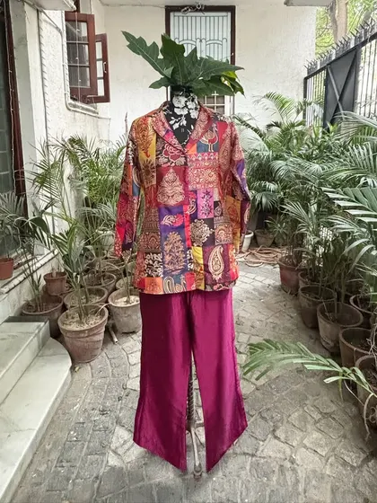 A closer look at the co-ord set with a stylish jacket and flared pants. Perfect for a modern, fashion-forward look.