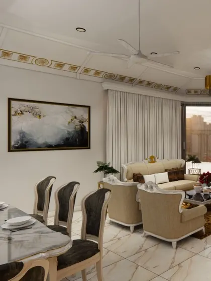 An expansive view of a luxurious open-plan living and dining area, showcasing a harmonious blend of classic and contemporary styles. Notice the detailed ceiling work with gold accents, plush furnishings, and marble flooring that create an atmosphere of sophisticated comfort.