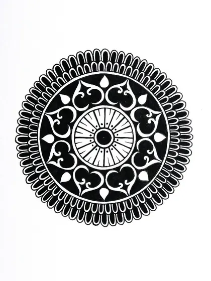 This was the last mandala I created for my Inktober 2022 challenge. It features heart-shaped motifs and a central wheel design, all done in black ink.