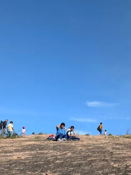 Taking a moment to relax and enjoy the vast, open landscape. Our treks provide the space for families to unwind and connect with nature on a grand scale.