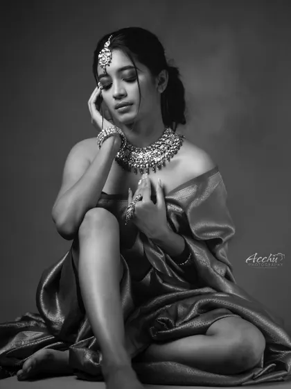 This black and white portrait is about timeless elegance. By stripping away color, we focus on the emotion, the texture of the fabric, and the intricate details of the jewelry. It’s a modern take on a classic Indian bridal look.