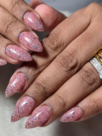 Bridesmaid nails need to be just as polished. This sparkling pink glitter set is a perfect choice for the bridal party, offering plenty of glam without upstaging the bride.