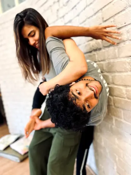 Partner work can be playful too. This inverted pose against the wall is a fun way to build strength and trust.