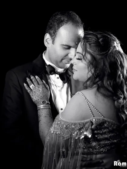 A classic black and white portrait that captures the deep emotion and connection between the couple. The dark background and soft lighting create a timeless and intimate feel.