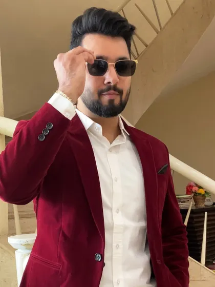 A sharp, confident pose in a red blazer. This is the kind of energy I bring to every event.