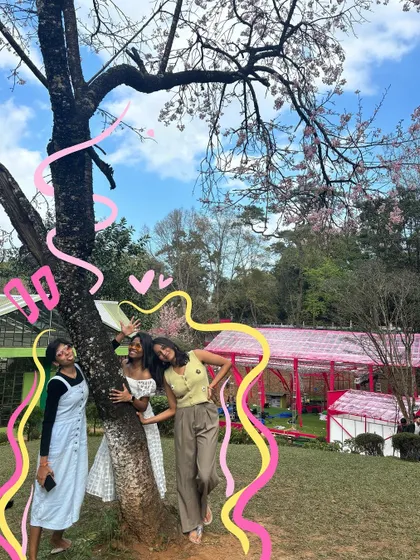 A fun group photo with friends under the cherry blossom trees, brought to life with colorful, energetic doodles.
