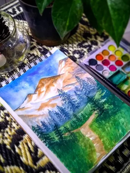 Inspired by the beauty of Mother Nature, this watercolor landscape depicts a serene mountain path. It’s a reminder of the tranquility of the outdoors, painted with soft washes and fine details.