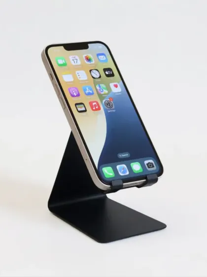 A clean shot of the black metal phone stand. Its minimalist design fits into any office environment while being incredibly useful.