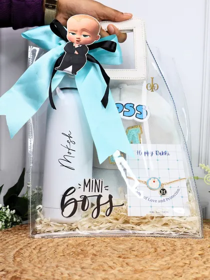 The "Mini Boss" Rakhi hamper is perfect for the youngest member of the family. It comes in a clear bag and includes a personalized water bottle and a matching rakhi.