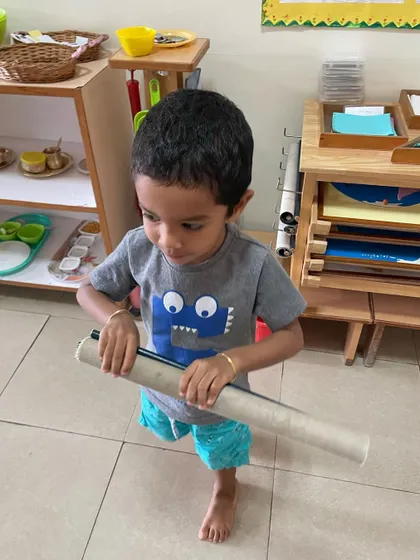 Choosing a work, taking it to a mat, and returning it to the shelf is a complete work cycle. This process teaches children independence, responsibility for their materials, and respect for the prepared environment.