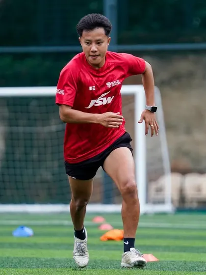 A coach demonstrates high-intensity running during a professional development day. We believe in leading by example.