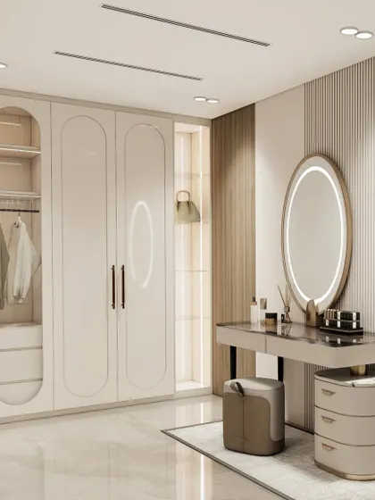 Here, the walk-in closet includes an integrated vanity. The backlit oval mirror and dedicated drawers create a perfect spot for self-care, seamlessly blending the wardrobe and dressing area into one cohesive, functional space.