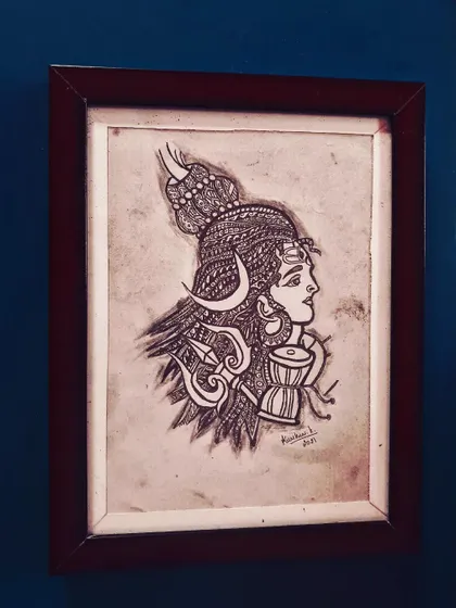 A profile drawing of Lord Shiva, incorporating zentangle patterns into his hair and ornaments. This A4 piece comes in a brown frame.