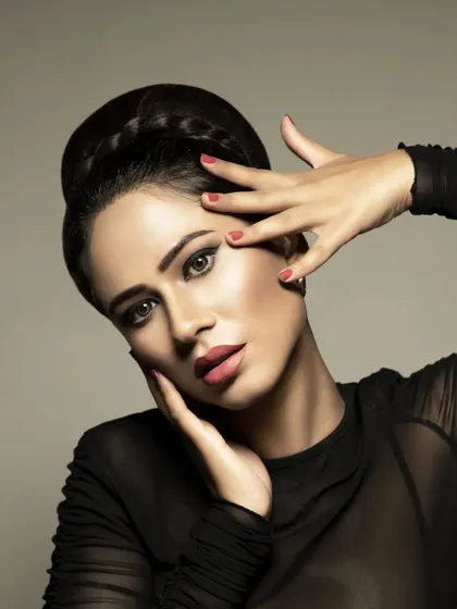A classic glamour look featuring a sharp winged eyeliner, a sculpted brow, and a soft matte lip. This style is timeless and works beautifully for formal evening events, receptions, or any occasion that calls for sophisticated party makeup.