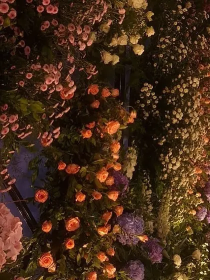 For this reception, we created a breathtaking backdrop with a wall of lavender and pastel florals. The strategic arrangement of hydrangeas, roses, and baby's breath created a magical and enchanting photo wall.