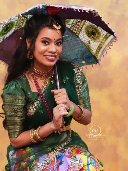 The addition of a traditional umbrella adds a playful and unique element to this Langa Davani photoshoot.